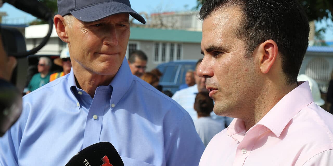 Ricardo Rossello and Rick Scott speak with reporters from Telemundo in Bayamon, Puerto Rico. Photo credit: Preston L. Chasteen