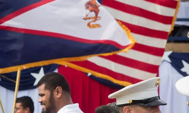 US Marine Staff Sgt. Ronald Orange, drum major, US Marine Corps Forces, Pacific band performs during the Flag Day Ceremony in American Samoa April 18, 2016. The band traveled to American Samoa to participate in their annual Flag Day Ceremony. Photo credit: Sgt. William L. Holdaway, US Marine Corps